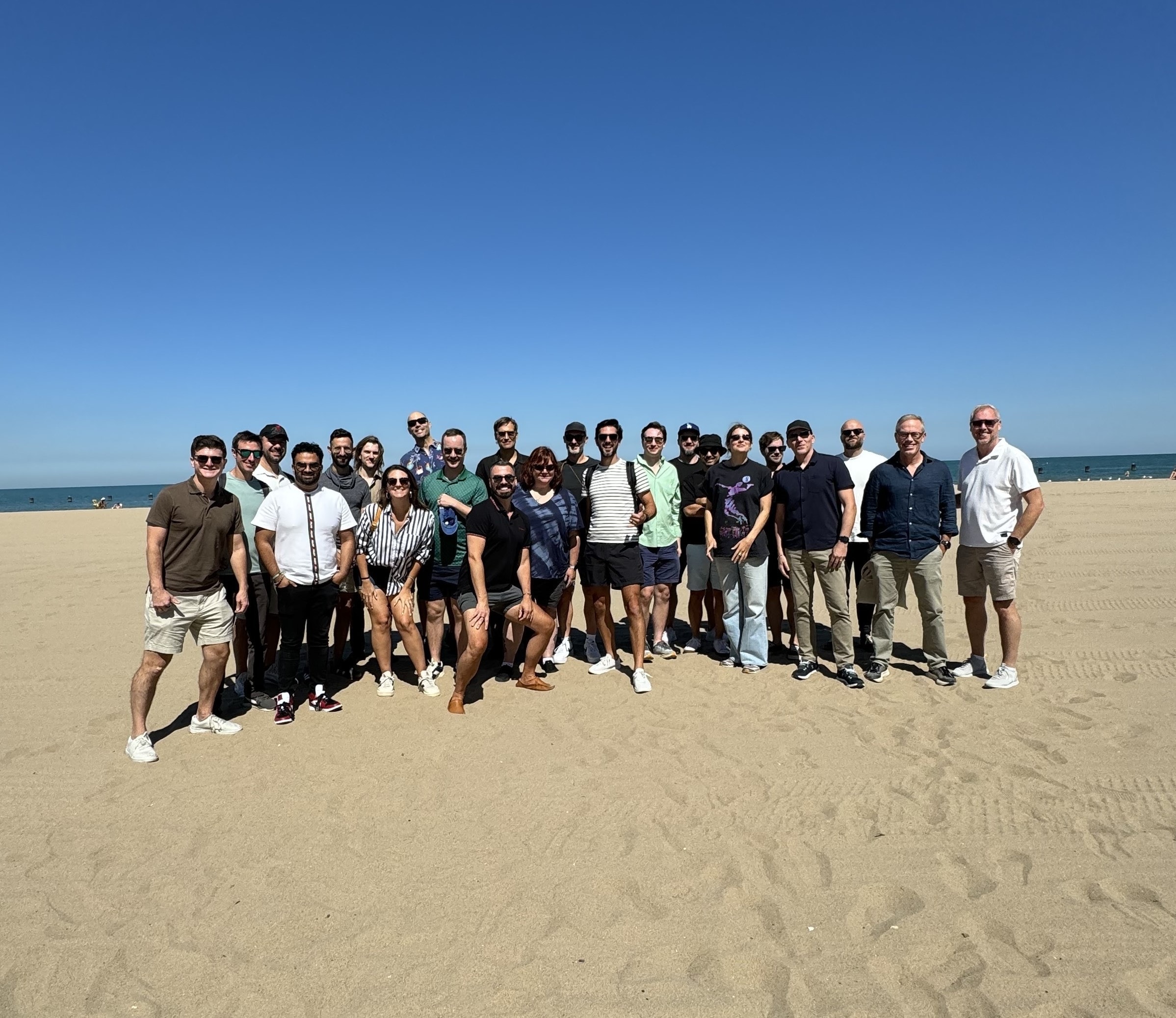 Punchkick team posing on a sandy field